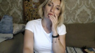 Russian woman caresses her slim body on camera
