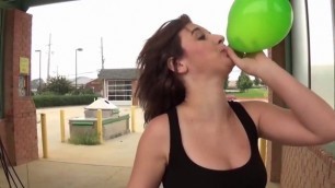 Fifi Foxx Blows and Pops Balloons Outdoors